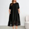 Robe mi-longue en mousseline de soie noire à manches courtes